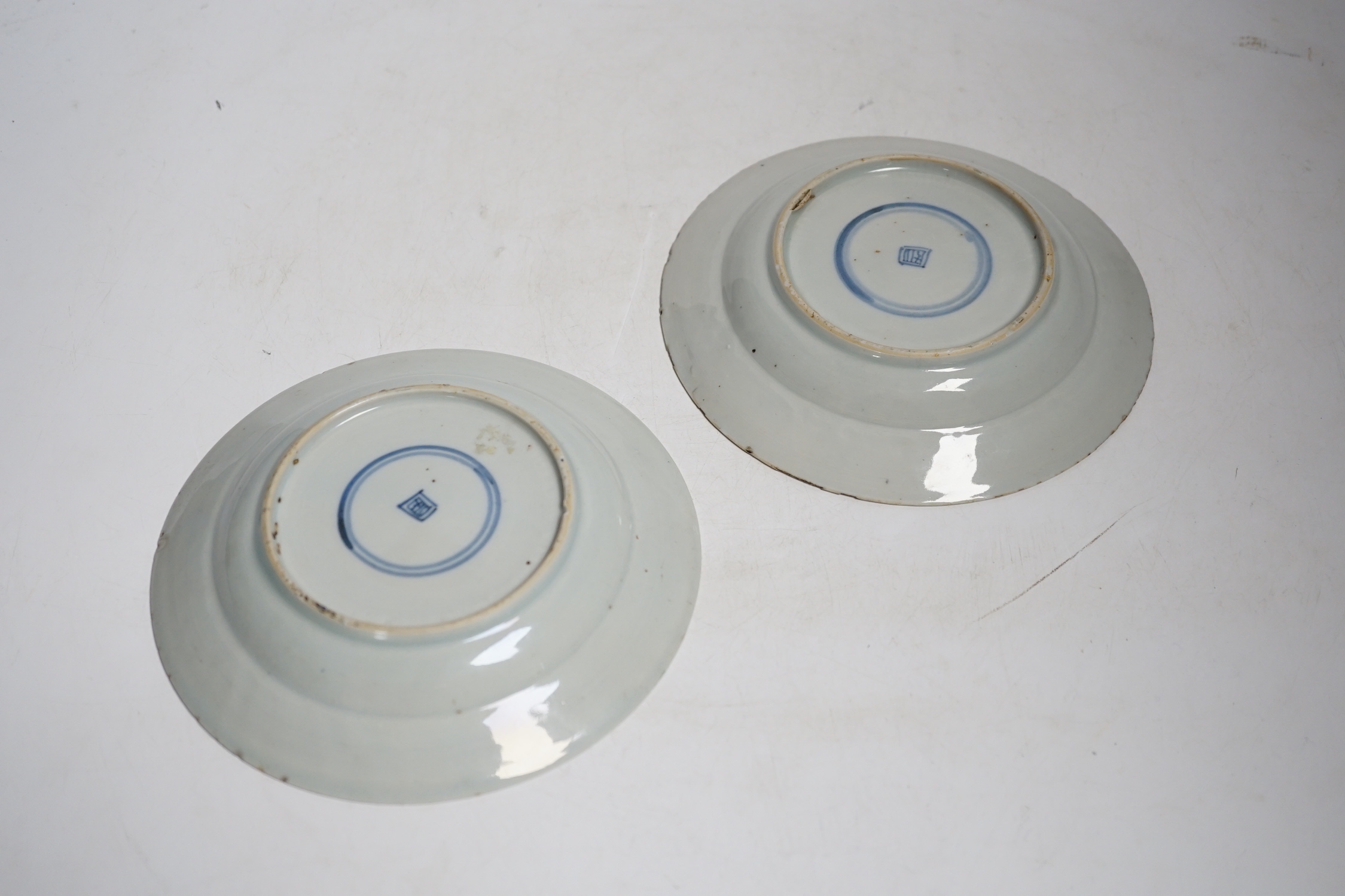 A pair of Chinese famille rose fencai small plates, early Yongzheng period, 16 cms diameter